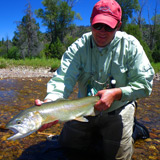 Jake w large rainbow from a small stream in Utah